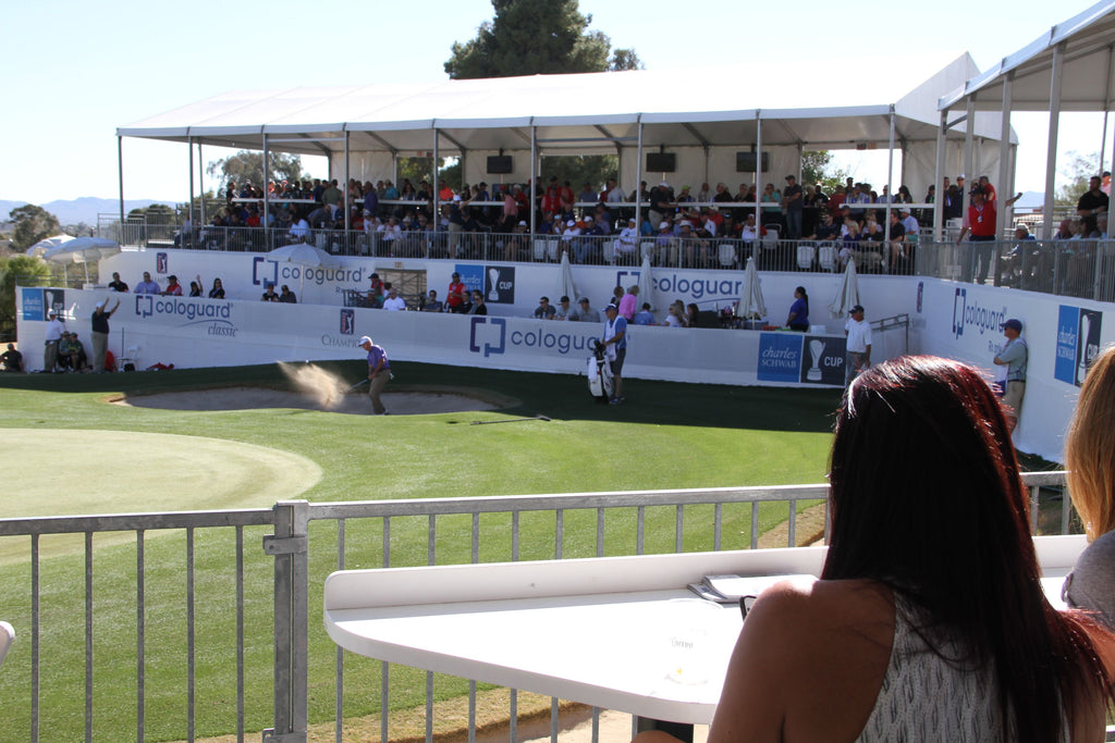 A golfer takes a shot in front of the Cabanas on the #16 Green at the Tucson Cologuard Classic