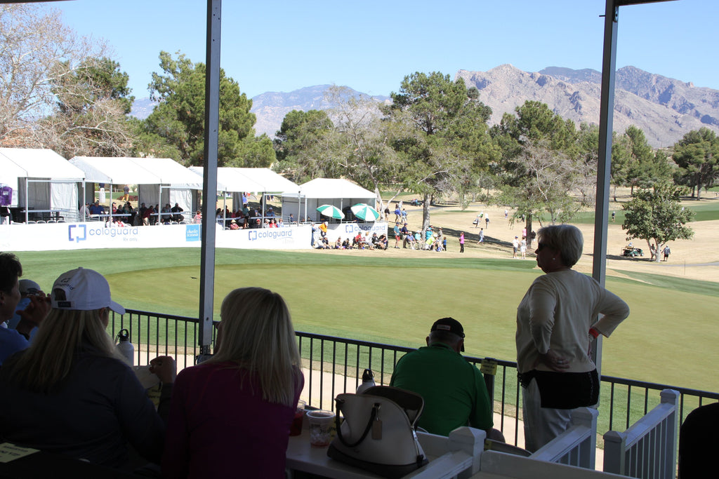 The shaded cabanas on the #16 green with mountains in the background at the Tucson Cologuard Classic